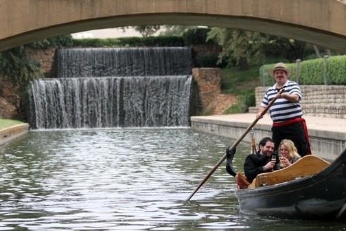 a person riding on the back of a boat