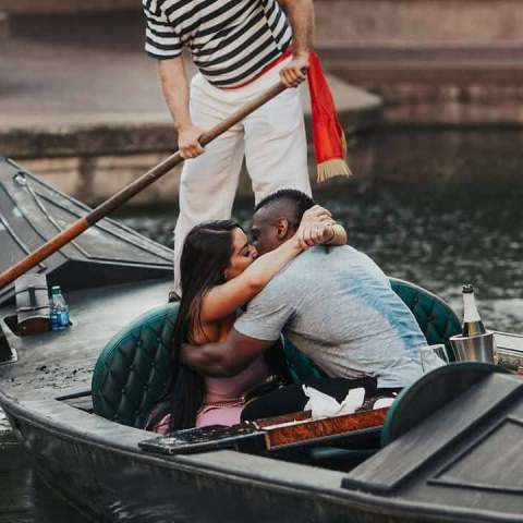 a person riding on the back of a boat
