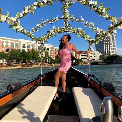 a person standing in front of a boat in the water