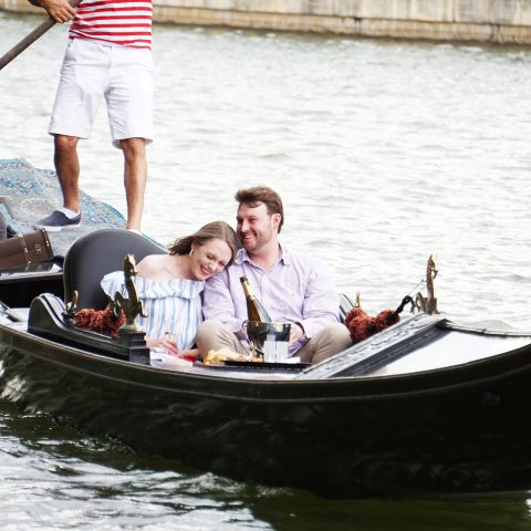 a man with a small boat in a body of water