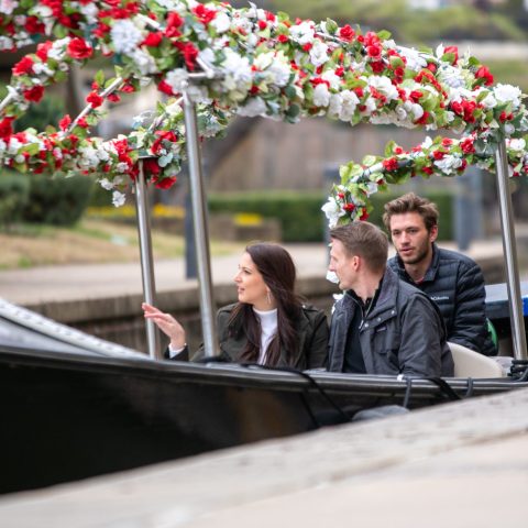a group of people riding on the back of a boat