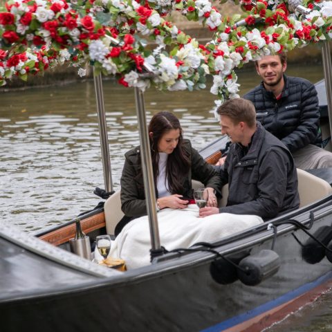 a person sitting on a boat in the water