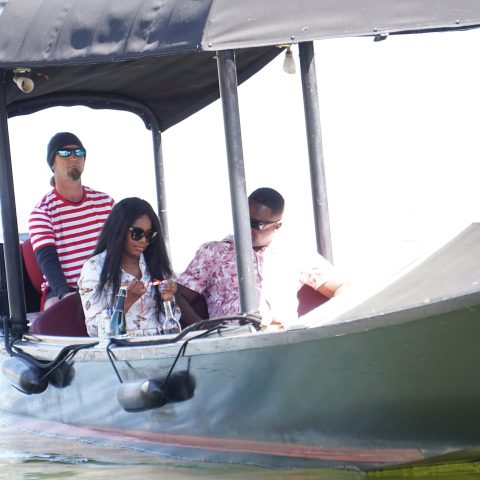 a man riding on the back of a boat