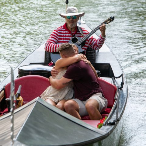 a man riding on the back of a boat
