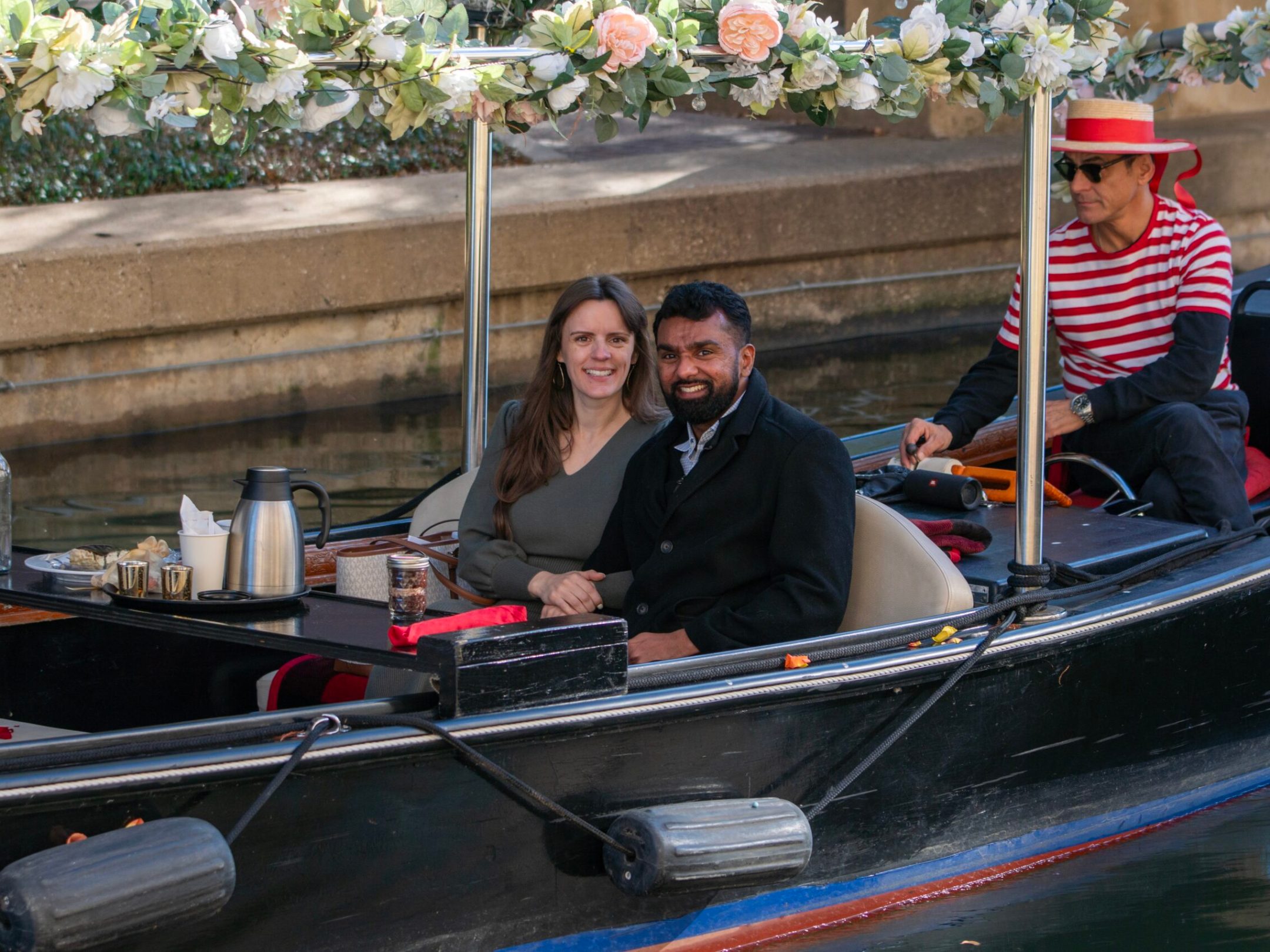 a man and a woman sitting on a boat