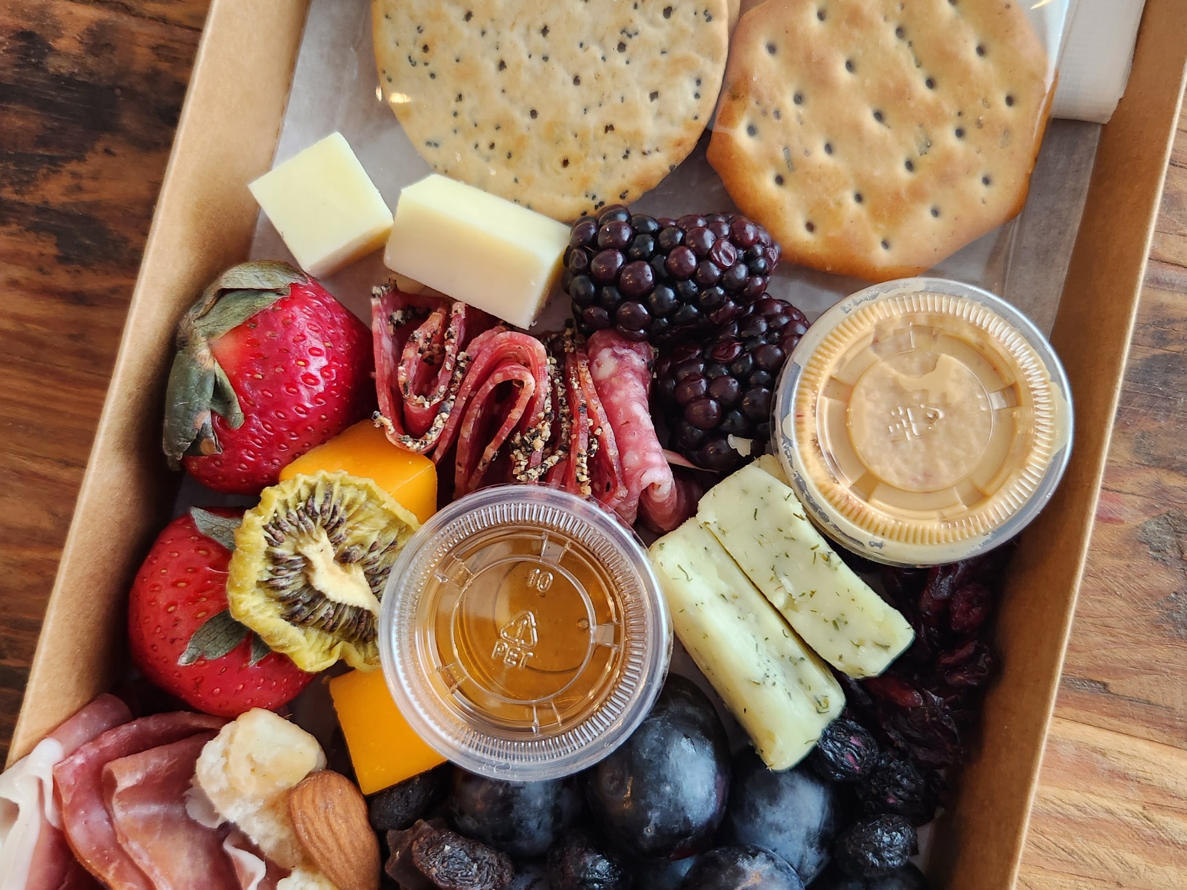 a tray of food on a wooden table