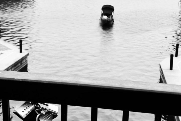 a boat is docked next to a body of water